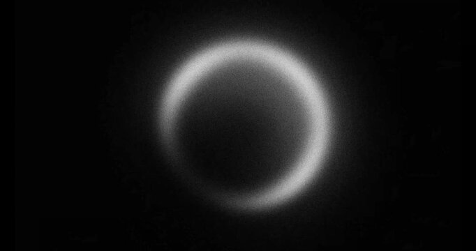 abstract black and white pulsating gradient ring, looping animation on dark background	
