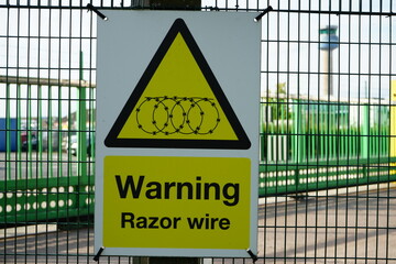 Warning Sign for Razor Wire at East Midlands Airport Trail, Nottinghamshire, England