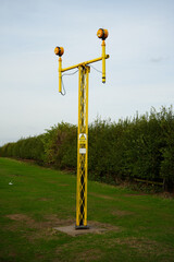 High Voltage Warning Sign on a Yellow Pylon: East Midlands Airport Trail, Nottinghamshire, England