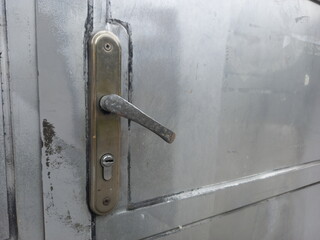 old door handle, street photo, metal texture 