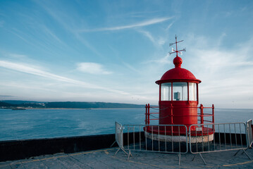 Historic Farol da Nazare Lighthouse with Panoramic View of Atlantic Coastline and Ocean Horizon