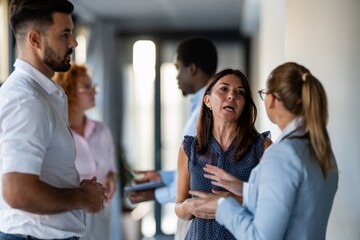 Business professionals engaged in serious workplace discussion