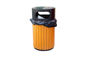 Brown rubbish bin garbage wood cylinder located with black garbage bag inside isolated on cutout PNG or transparent background. Waste collection equipment in park protect the environment.