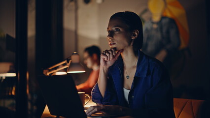 Creative startupers thinking project working overtime in company office. 