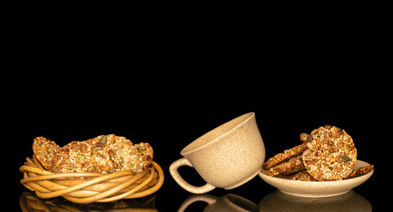 Thaler cookies with nuts and honey isolated on black background, close-up.