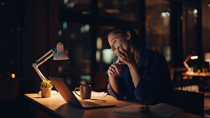 Multitasking sturtuper talking cellphone typing laptop at night office closeup. 
