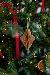 Christmas decorations: paper lantern on a branch of the christmas tree.
