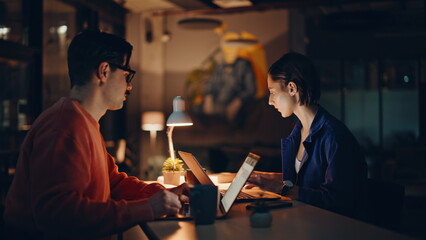 Business partners working night office in lamp light closeup. Manager document