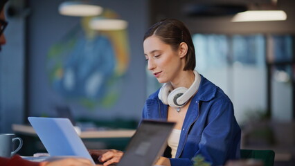 Smiling woman talking colleague working together at office open space closeup.