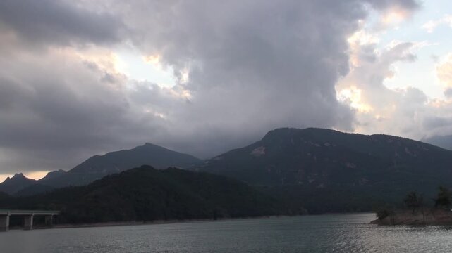 Baells reservoir lake pond island mountains clouds overcast trees water