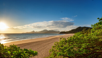 Tranquil Beach Scene Du Sunset With Lush Green Trees Overhanging Sandy Shore And Distant Mountains