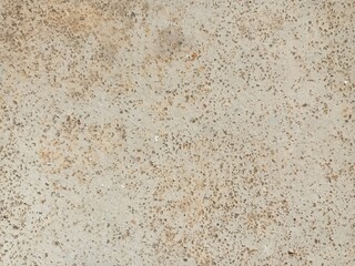 Close-up of a textured concrete floor with scattered aggregate