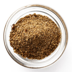 High-quality closeup image of ground spice mix in a transparent glass bowl on a white background, viewed from above.