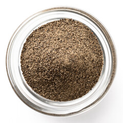 High-resolution closeup photo of ground black pepper in a transparent glass bowl on a white background, top view.