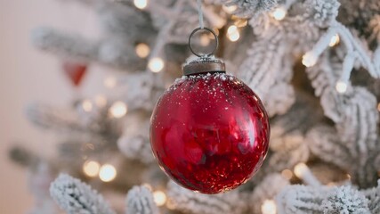 Christmas tree ornament red bauble glitter frost branches, glowing holiday lights, festive seasonal background, New Year celebration decor, traditional winter scene, cozy holiday spirit, sparkling dec - Powered by Adobe