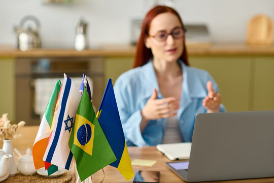 Language teacher with red hair inspires students during online lessons from home