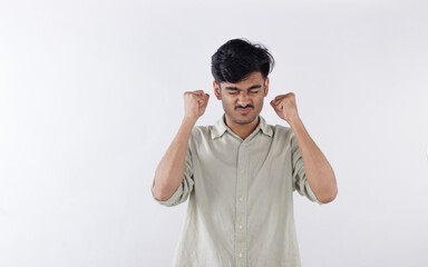 Fototapeta premium Portrait of an Indian Asian man showing stress and anger. Concept representing frustration, mental pressure, anxiety, and emotional struggle