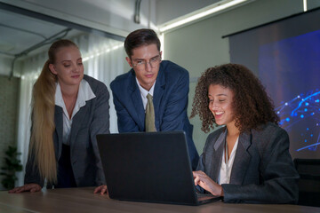 Team collaborates on project in modern office setting during daytime meeting