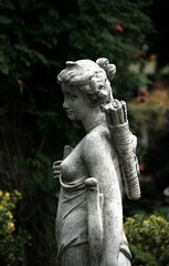 statue of a woman in a garden