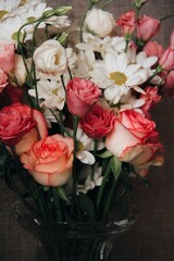 Bouquet of a pink flower and white chamomile