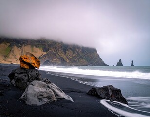 Dramatic Icelandic Black Sand Beach Scenery Under Cloudy Sky.