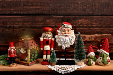 Christmas decorations in vintage style on wooden shelf