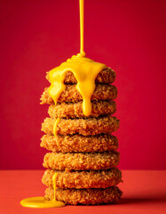 Golden Fried Nuggets Drenched in Cheese Sauce