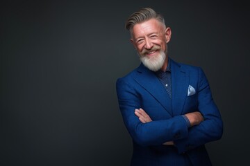 Fototapeta premium Stylish smiling senior man with a fashionable gray beard and haircut
