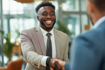 Happy African American businessman shaking hands in a business deal