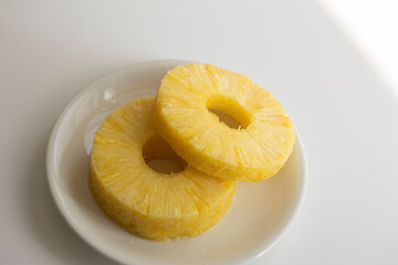 Fresh cutting pineapple on white background.