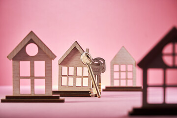 Simply design with miniature white toy house isolated on pink background