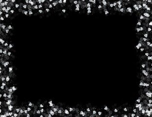 frame of glittering hearts on a black background
