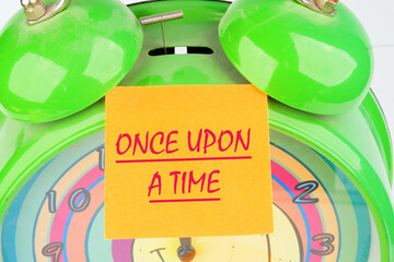 ONCE UPON A TIME text the inscription on the sticker on top of the alarm clock