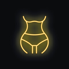 Yellow neon light representing a woman body shape with thin waist on a black background