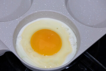Fried egg in a frying pan.
