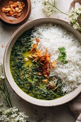 Spinach (Palak) dal with basmati rice, garlic tadka, coriander garnish, minimal terrazzo setting