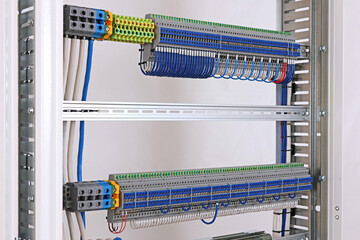 Electrical screw terminals for connecting wires in an electrical switchboard. Soft focus. Close-up.