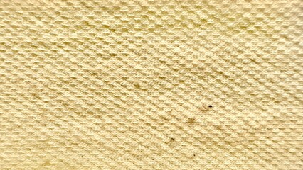 close-up woven beige fabric texture with subtle grain pattern, perfect for background use, editorial design, or wallpaper applications