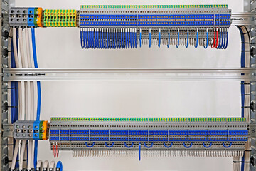 Electrical screw terminals for connecting wires in an electrical switchboard. Soft focus. Close-up.