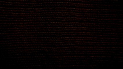 dark textured fabric close-up with intricate woven pattern perfect for creating dramatic...