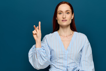 Engaging language teacher demonstrates sign language in vibrant classroom setting