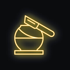 Neon sign representing a knife cutting a chocolate ball on a stand, with a yellow glow effect on a black background
