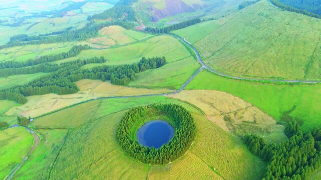 Pond Pau Pique and Lush Green Hills. Azores, Sao Miguel Island. Portugal. Aerial View. Drone Moves Forward, Tilt Down