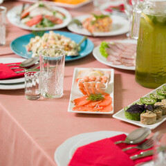 Elegant seafood appetizers and salads on a banquet table.