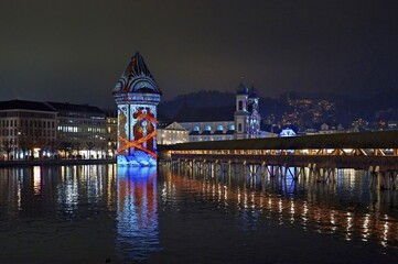 Wassertum with light installation, Chapel Bridge on the right, Jesuit Church on the Reuss at dusk behind, Old Town, Lilu, Light Festival 2025, Lucerne, Canton of Lucerne, Switzerland