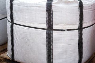 A big bag package, using to contain chemical or sand material that prepare for the transportation. Industrial equipment object.