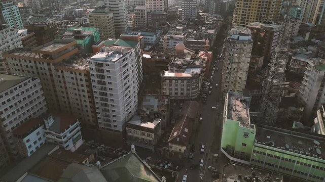 Drone Aerial of Dar es Salaam City Skyline with Old Buildings under Cloudy Sky in Tanzania