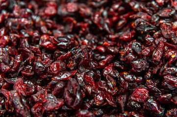 A variety of dried, pitted cherries. Dried cherries on a store shelf. Delicious, healthy food and dessert.