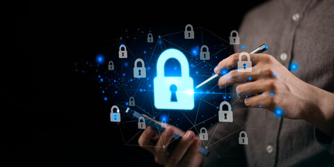 Concept of cybersecurity and data protection with glowing padlock icons, symbolizing secure digital access, privacy, online safety for mobile devices, cloud technology, business information systems. © Nichaphat