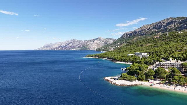 Breathtaking Brela coastline: An idyllic view of beautiful Punta Rata beach, with crystal-clear turquoise waters, white pebbles, majestic Biokovo mountains,perfect for a dream vacation